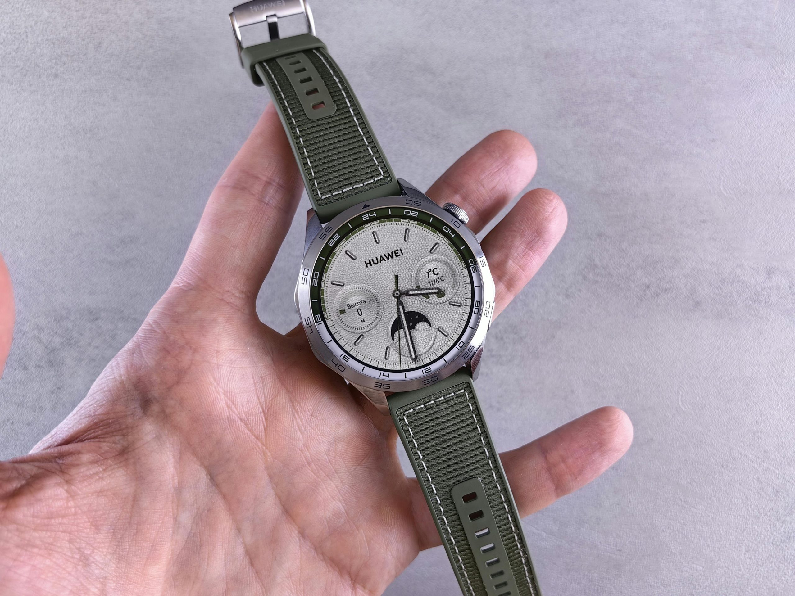 Close-up shot of a sleek watch displaying altitude and atmospheric pressure readings