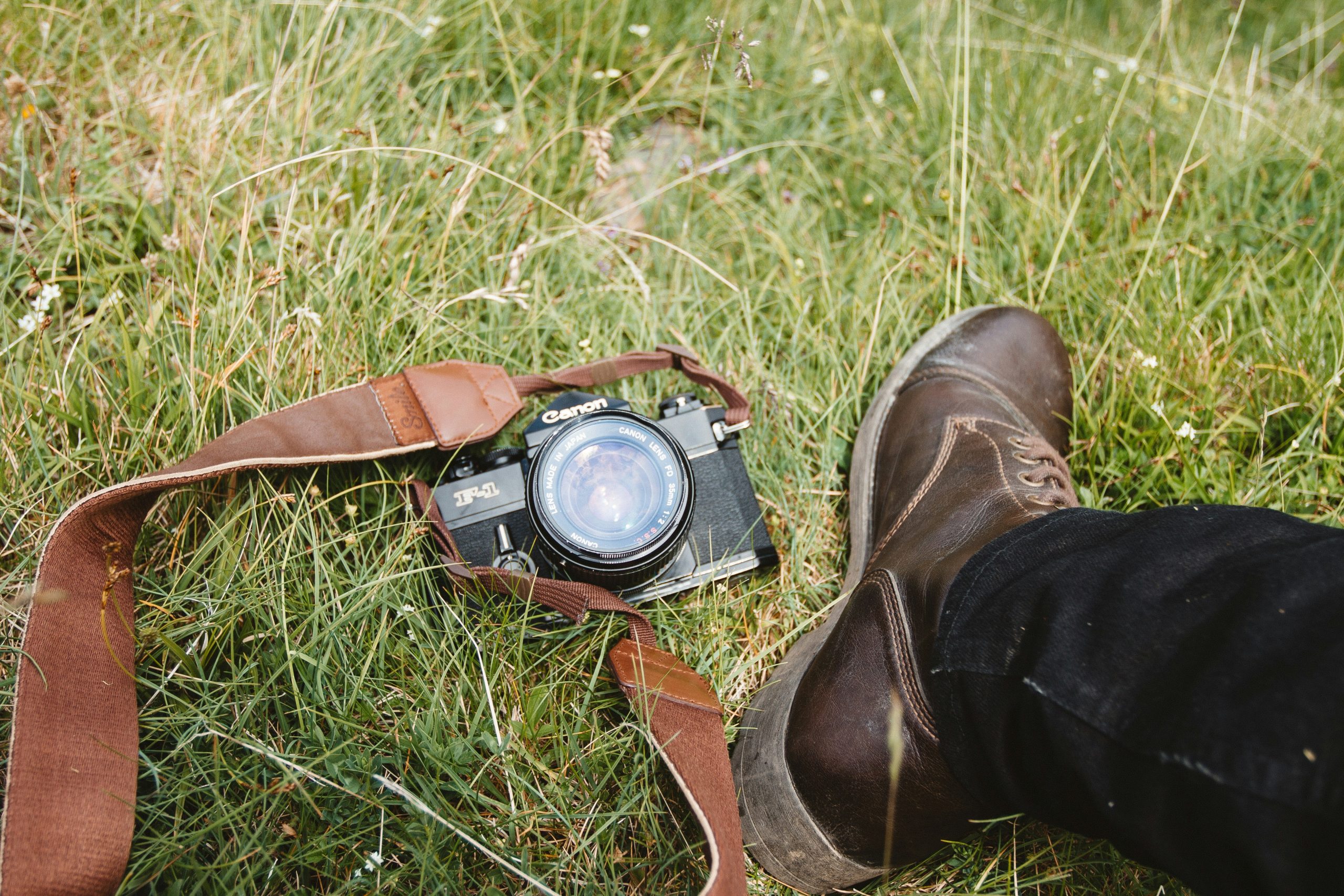 A climber holding a Garmin smartwatch with visible altimeter readings.