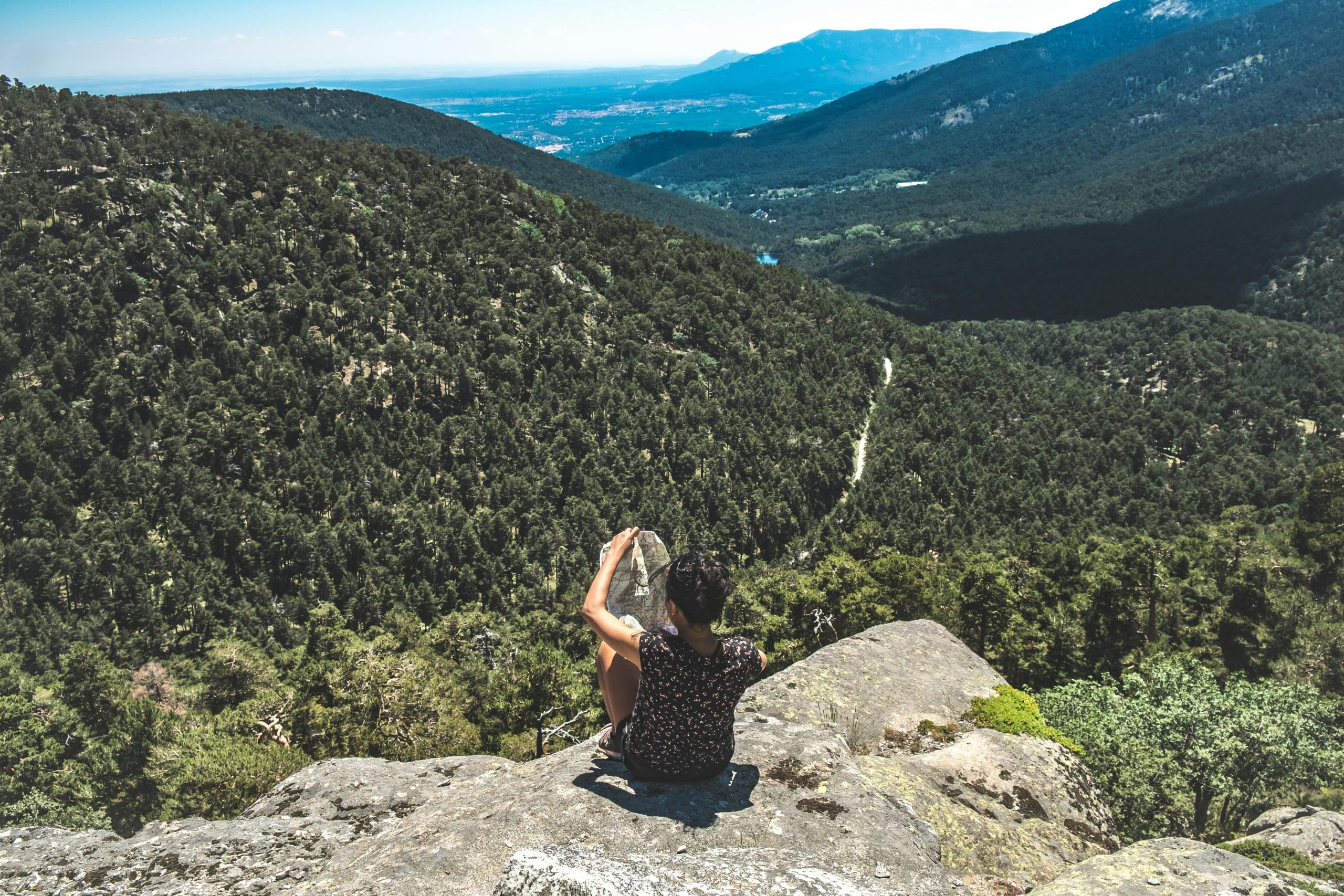 Confused hiker looking at outdated paper map