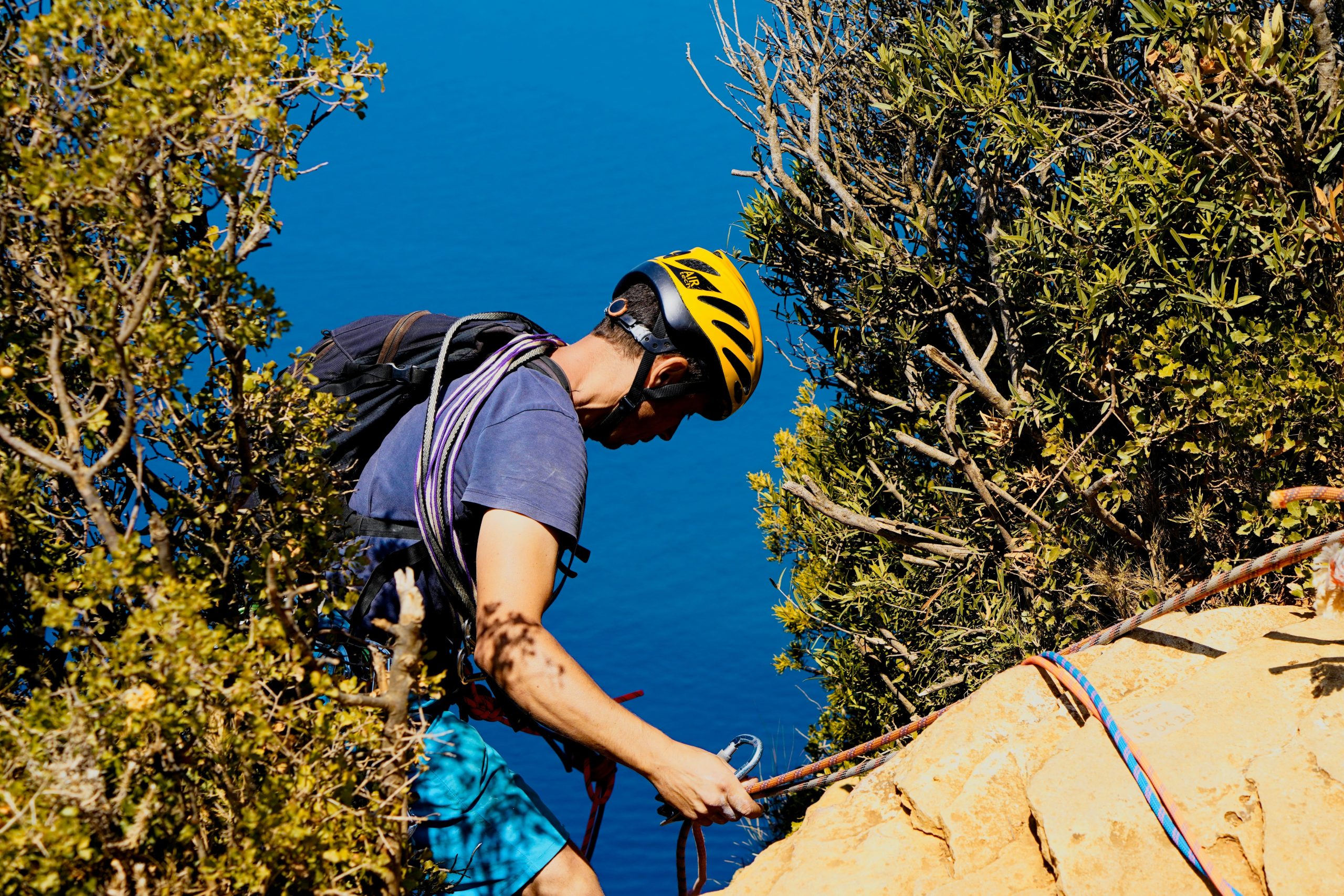 Professional climber using a watch altimeter during ascent