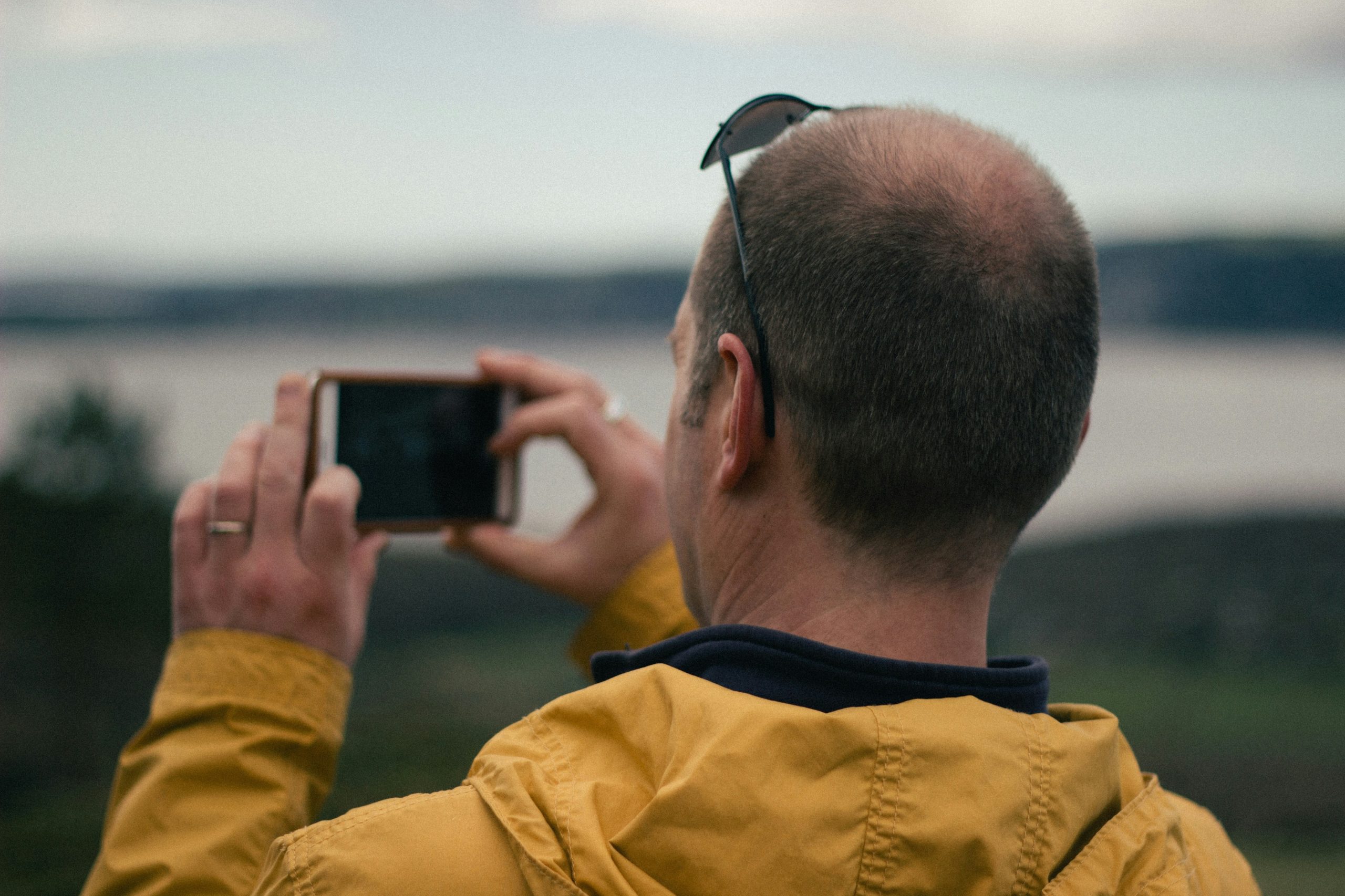 Rescuers helping a stranded hiker who survived using his smart watch altimeter to communicate location data.