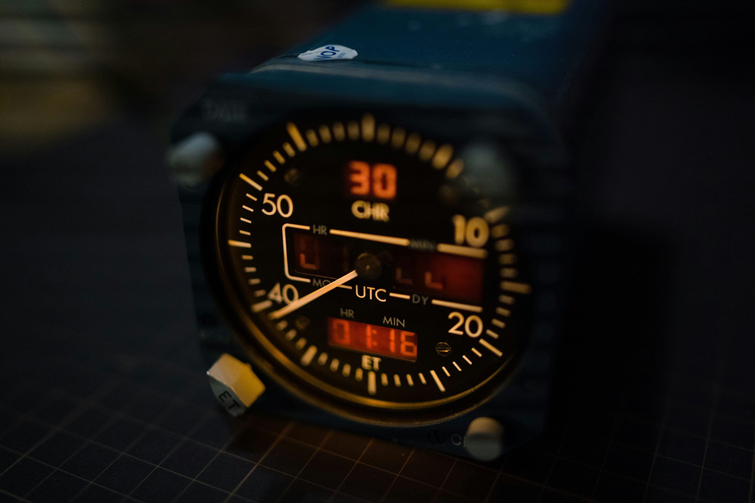 A close-up shot showing a smartwatch firmware update screen on a laptop connected via USB.