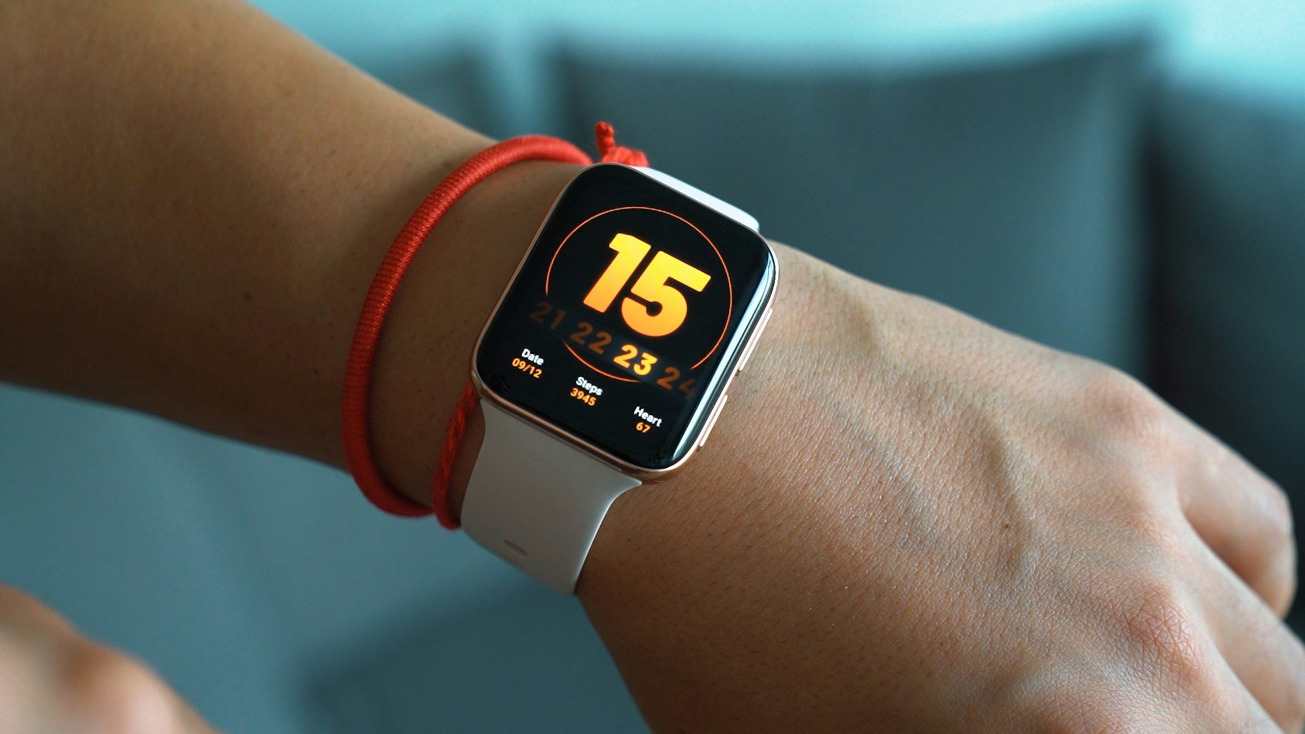 A hiker wearing a smartwatch checks altitude readings while hiking a mountain.