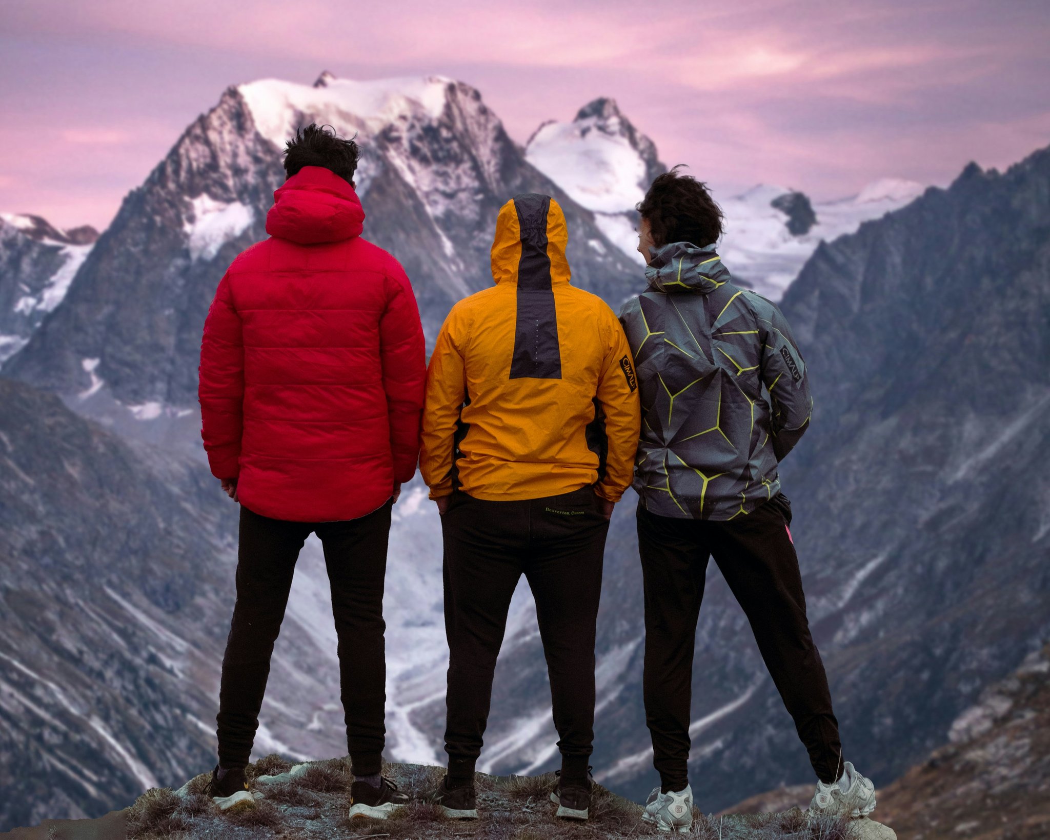 Happy hiker standing atop a peak with watch on wrist