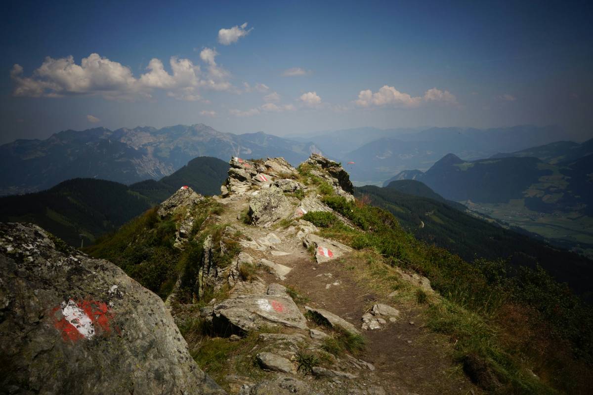 A cracked hiking watch lying on rugged terrain