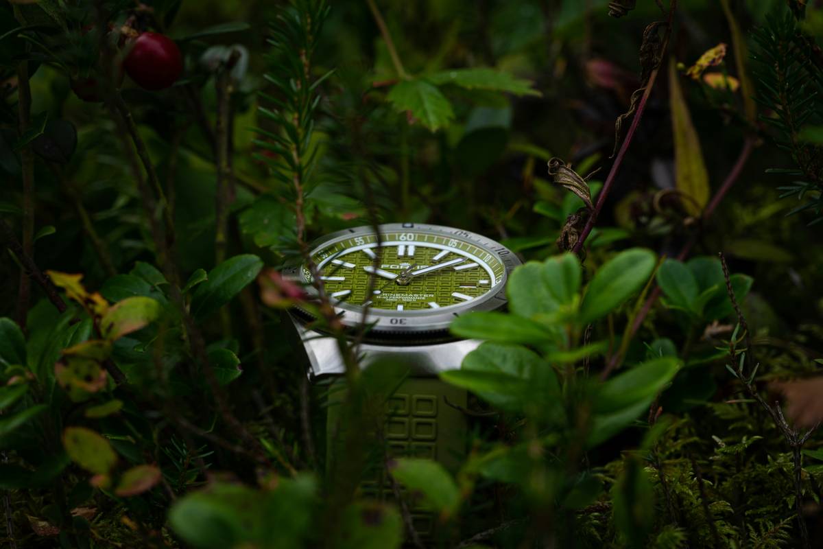 A person wearing a smartwatch during a hike